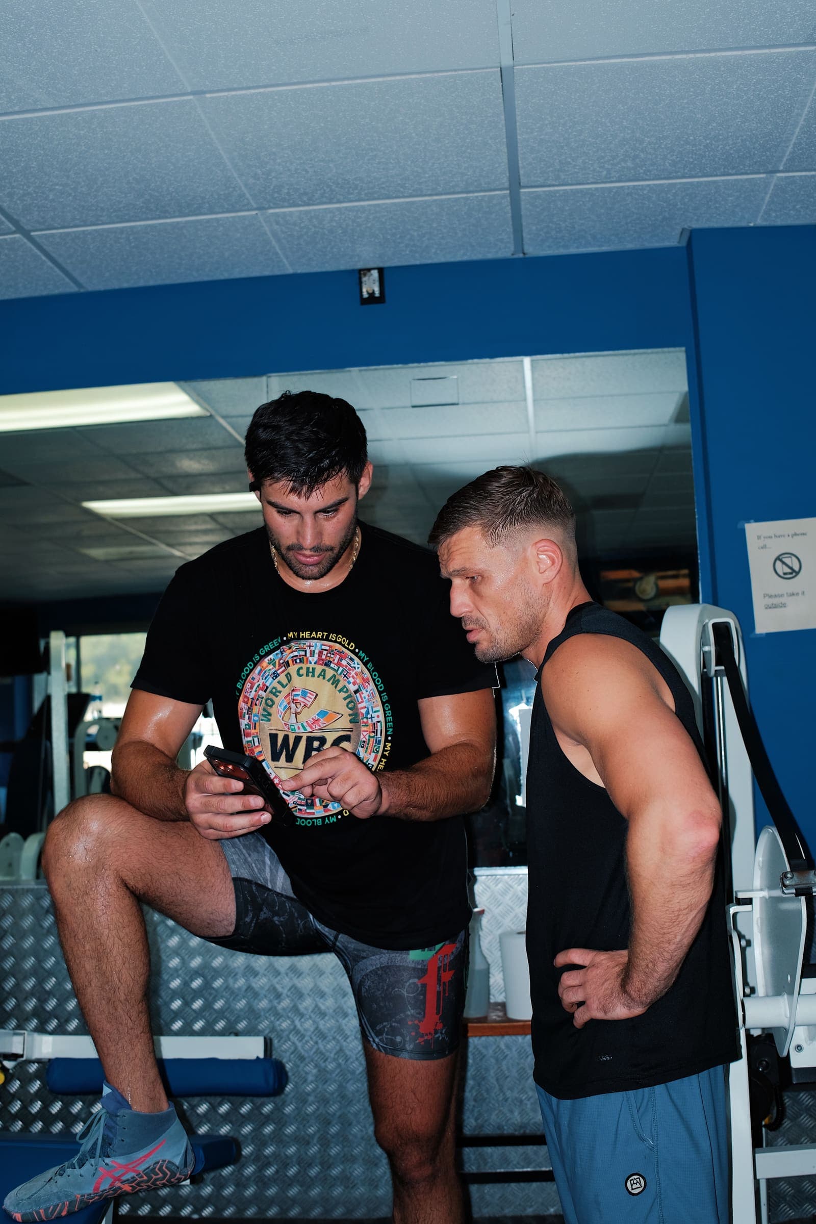 Reviewing session footage with the coaching team at the gym