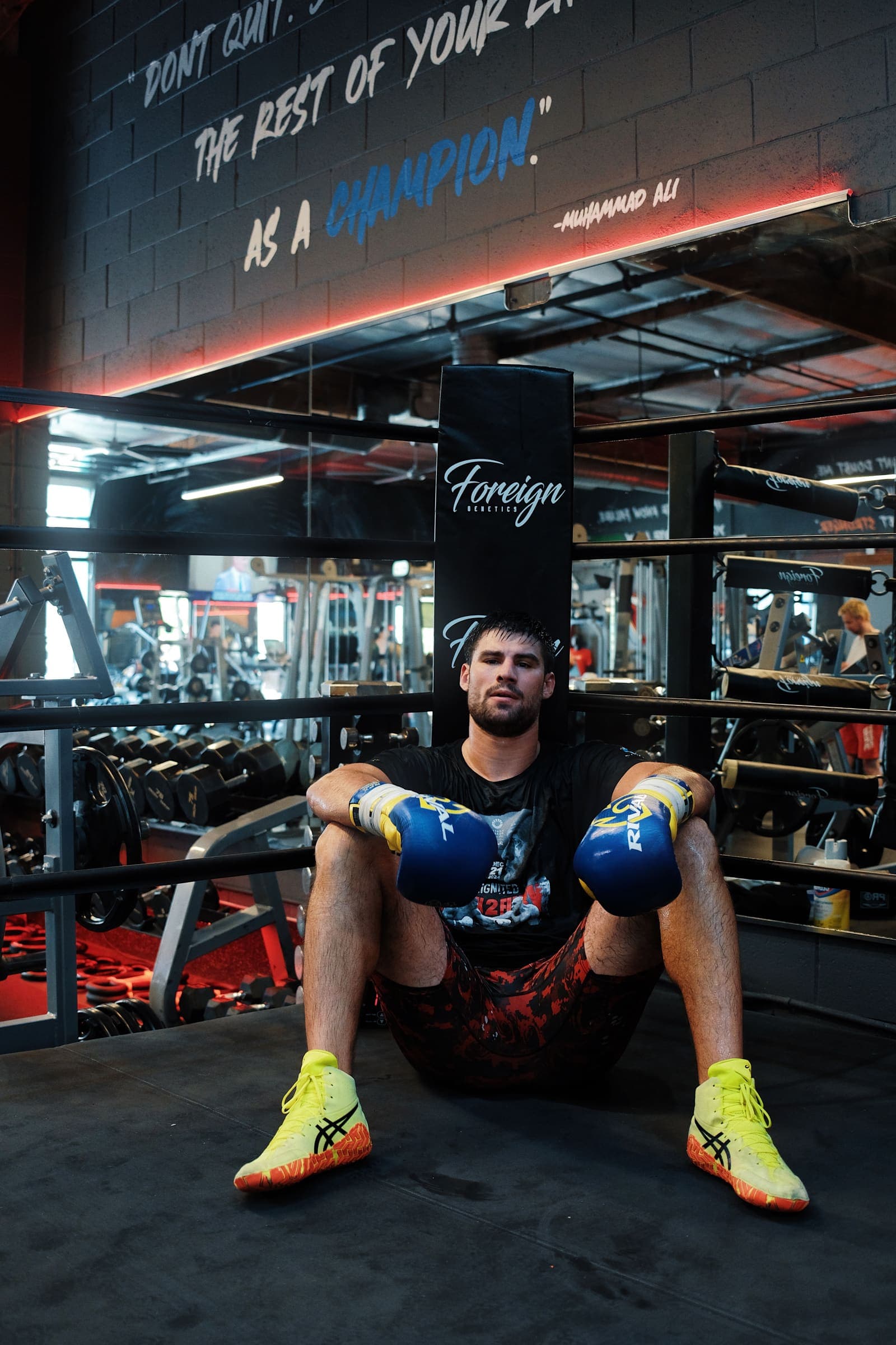 Andrii Novytskyi seated in the ring corner after a session, gloves resting on his knees